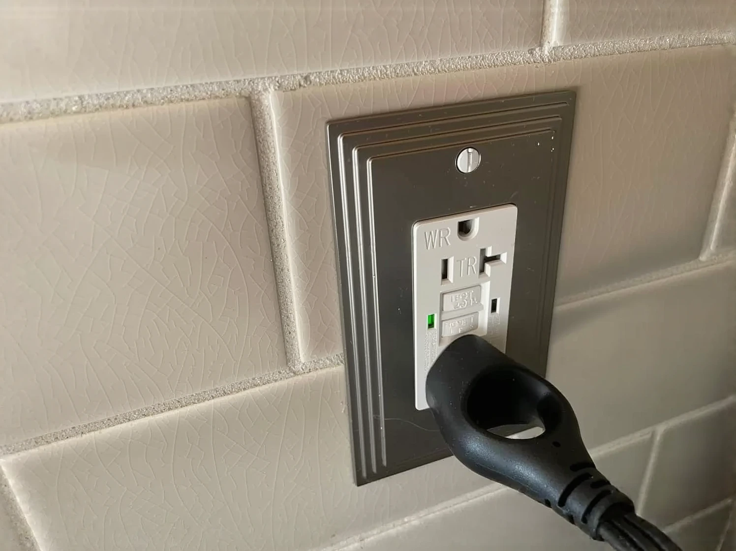 Customer photo of GFCI outlet installed on wooden dock post near water