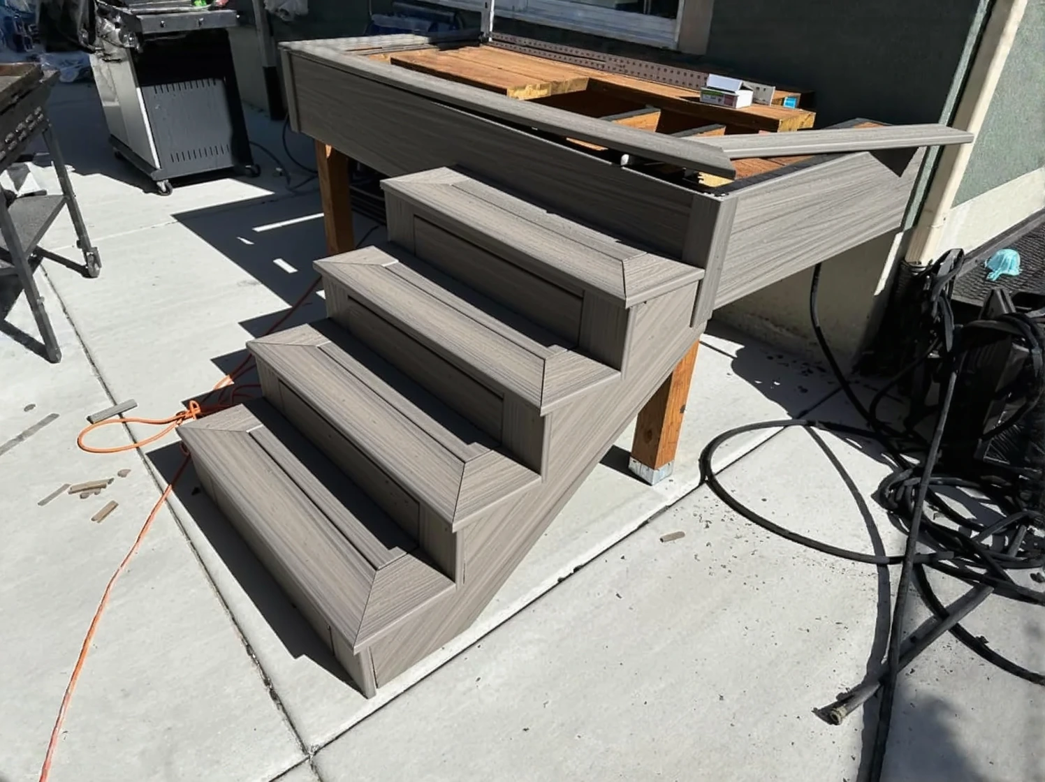 Customer photo of composite decking boards showing weathering and discoloration after 5 years in salt air environment